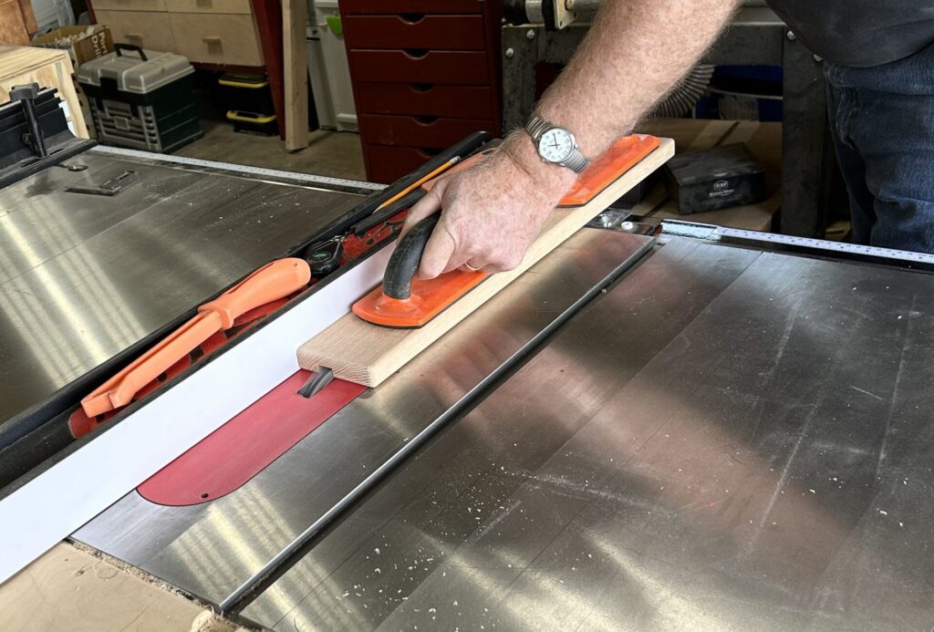 Cut a groove in the fence for T-track